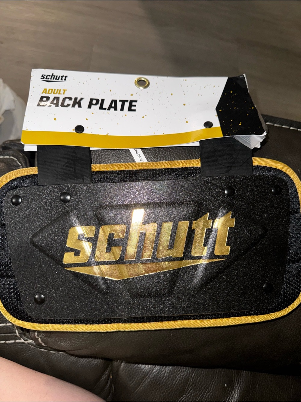 Schutt Adult Back Plate in Black with Gold Logo